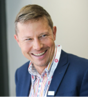 A headshot of Dr Lukasz Porwol.